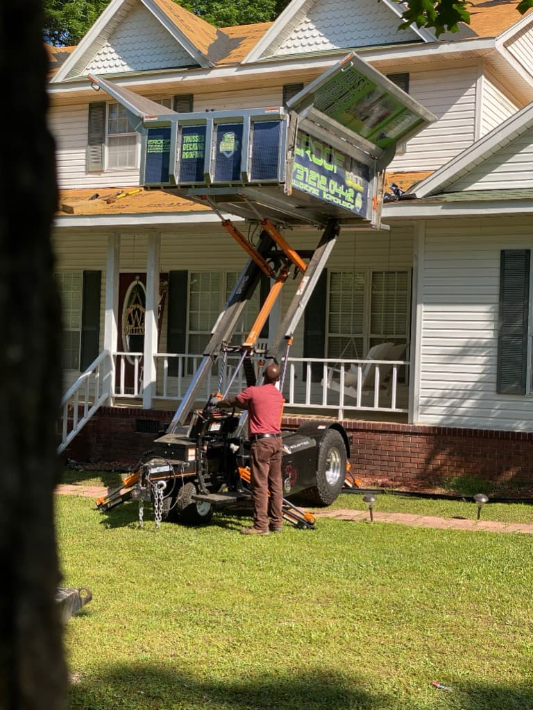 eRoof material lift delivering shingles to a roofline